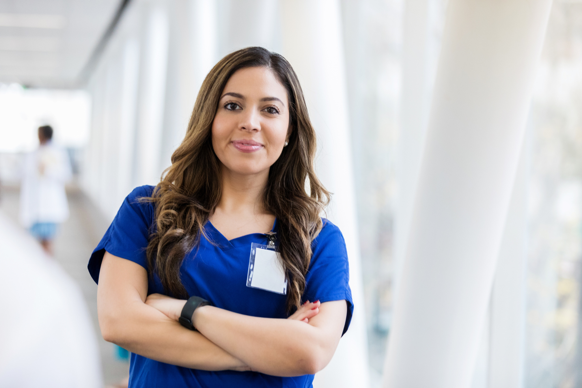 Confident young Hispanic female nurse